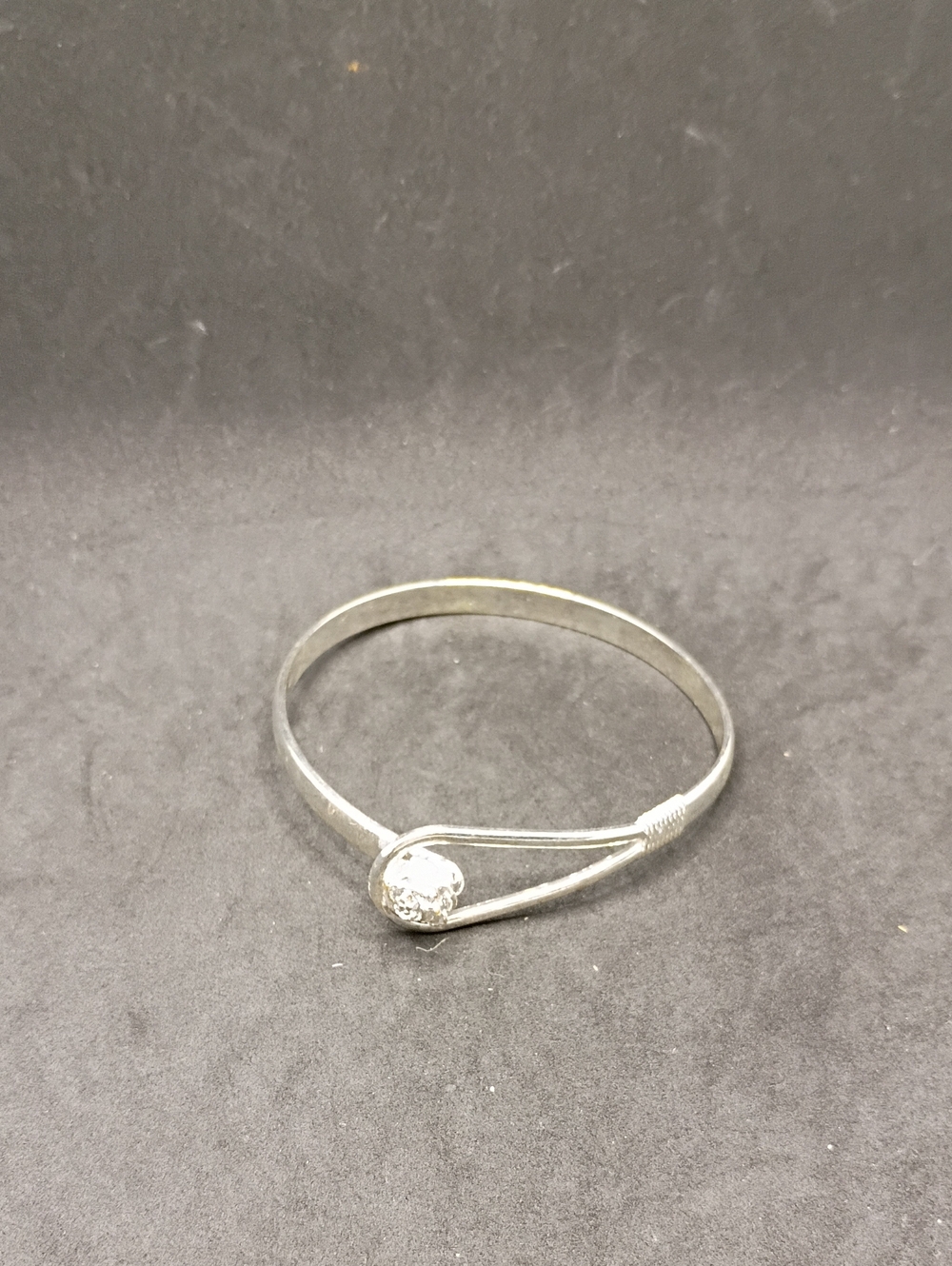 Silver Toned Women's Bangle Bracelet with Decorative Accent